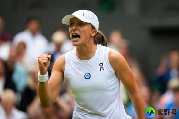 Iga Swiatek of Poland reacts to defeating Belinda Bencic of Switzerland in the fourth round.