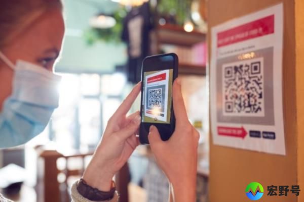 Woman In Mask With Mobile Phone Checking Into Venue Scanning QR Code During Health Pandemic