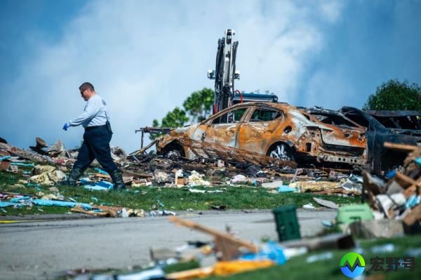 An investigator walks through the debris from a home explosion on Aug. 13, 2023, which occurred the day before in Plum, Pa. 