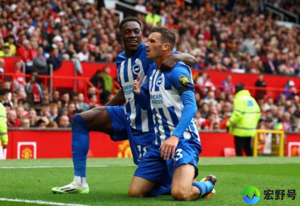 Pascal Gross celebrates scoring their second goal with Danny Welbeck