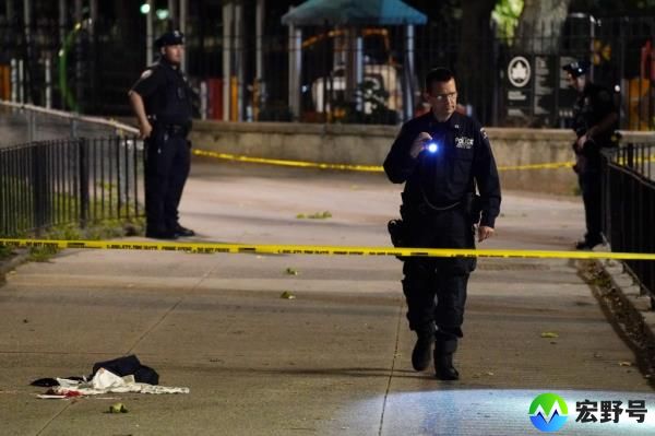 Police at the scene of the East River Houses shooting Friday.