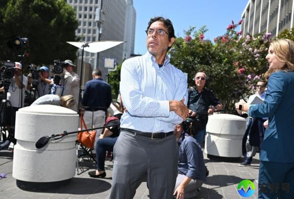 Mark Chavez, the ketamine doctor, standing outside Roybal Federal Courthouse with his arms crossed after court appearance.