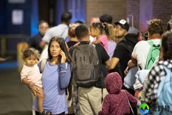A migrant woman and child who got off the bus at the Port Authority Bus 