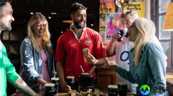 Rugby fans enjoying drinks and nibbles at the pub