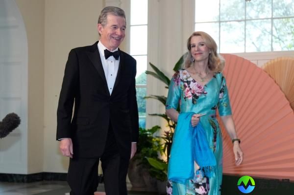 North Carolina Gov. Roy Cooper and his wife Kristin Cooper entering the dinner.