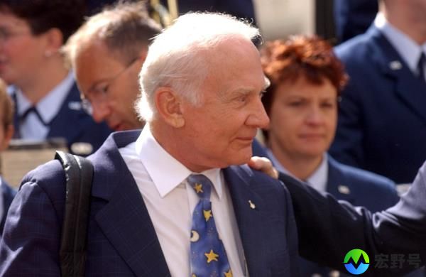 Buzz Aldrin in a suit and tie at the launch of the Centennial of Flight exhibit at Rockefeller Center, New York City, celebrating the 100th anniversary of Wright Brothers