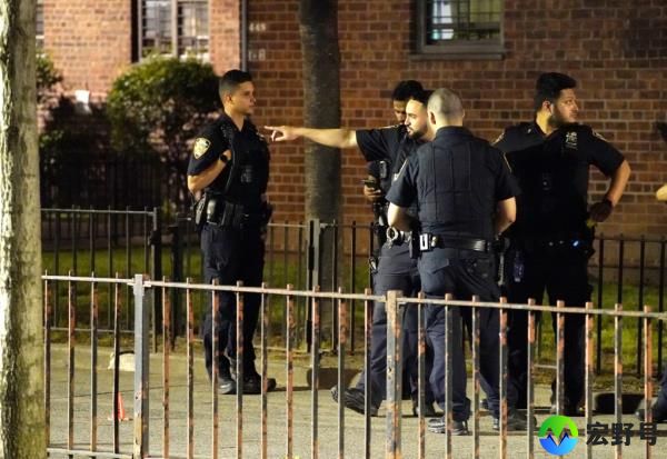 Police at the scene of the East Harlem shooting Friday.