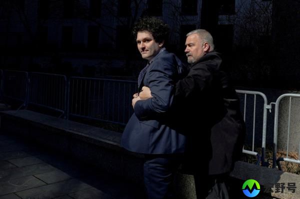 Former FTX Chief Executive Sam Bankman-Fried being escorted outside the Manhattan federal court in New York City, U.S., 2023