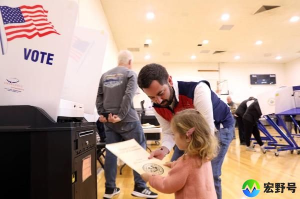 Republican Rep. Mike Lawler casts his ballot with two-year-old daughter Julianna on election day at St. Aedan