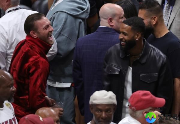 Co<em></em>nor McGregor has a laugh with Odell Beckham Jr. during NBA Finals Game 4 on Friday night.