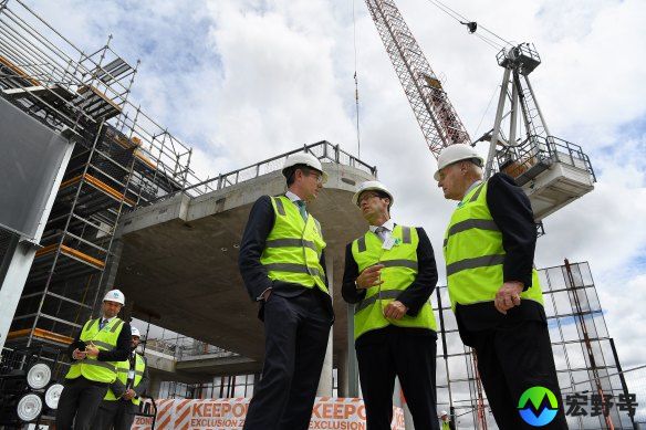 Former NSW Premier Dominic Perrottet (3rd from left) and Lang Walker (right) attending a topping out ceremony at Parramatta Square in 2021.